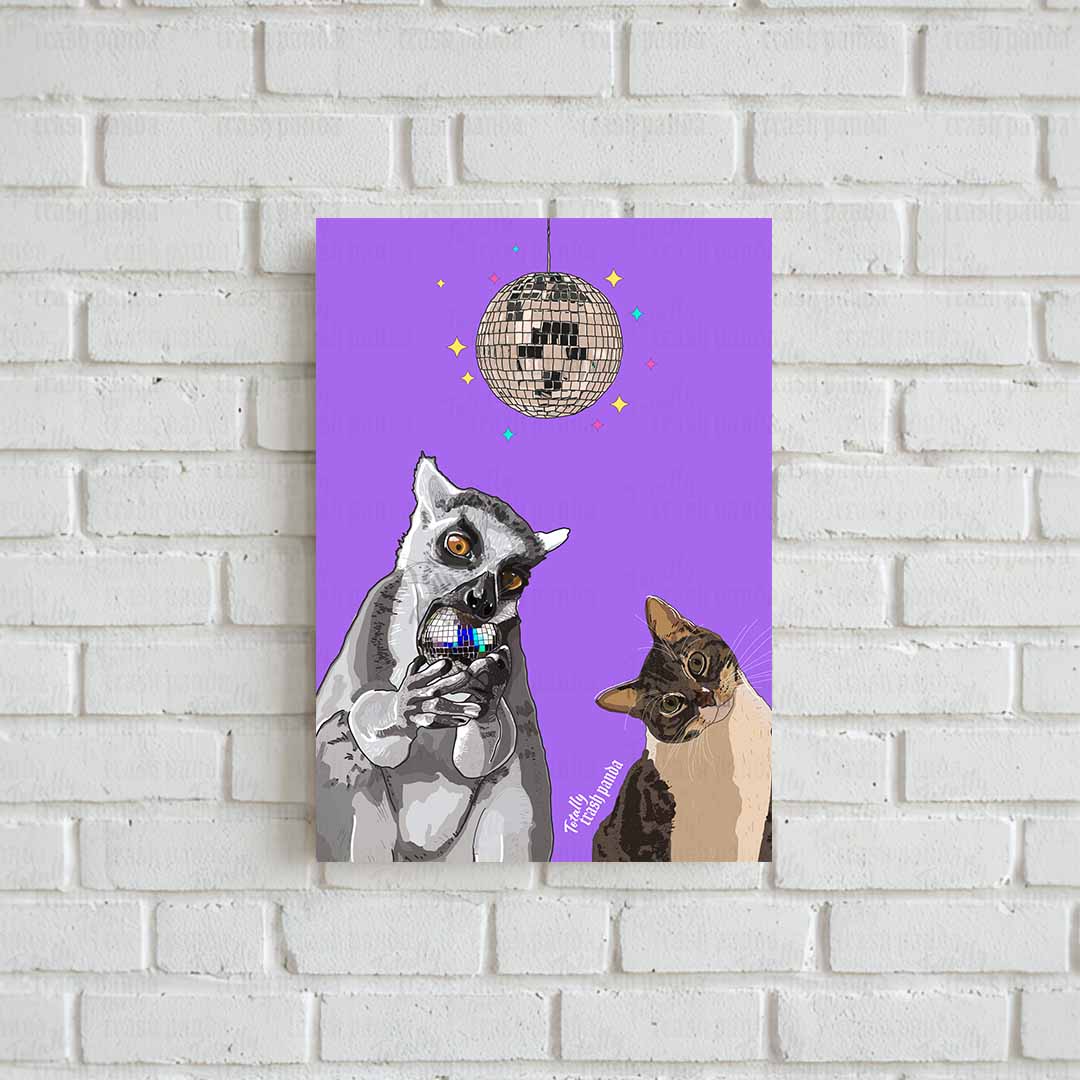 Lemur eating a disco ball and a curious looking cat tilting its head sitting under a disco ball that is surrounded by different coloured sparkle shapes. All set on a vibrant purple background. The white 'Totally Trash Panda' brand logo sits in between the cat and lemur at a diagonal angle. 