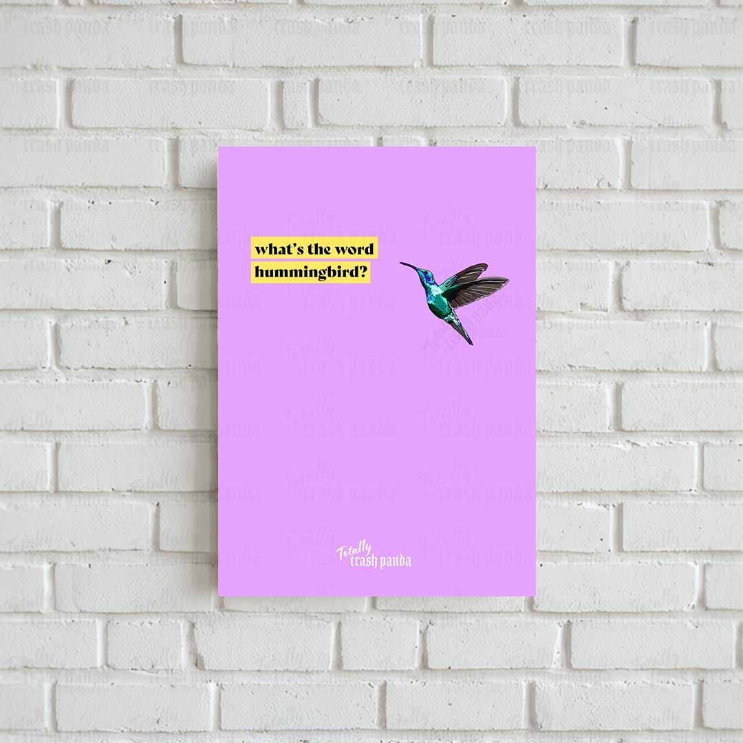 Illustration of a green hummingbird flying next to text on a yellow background that reads: 'what's the word hummingbird?' All on a light purple background. The brand logo 'Totally Trash Panda' is at the bottom centre of the poster.